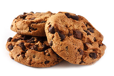 Stack of homemade chocolate chip cookies on white background